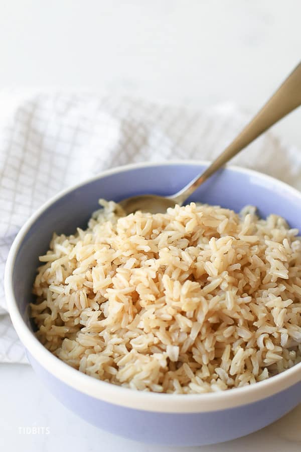 Pressure cooker brown rice in a light blue bowl