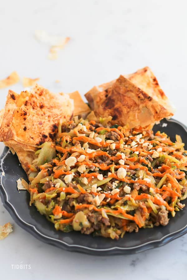 Pressure Cooker Egg Roll Bowl: Say goodbye to your deep fried egg roll cravings, and say HELLO to egg roll in a bowl.  This deconstructed egg roll is a juicy flavor bomb in a bowl and brings home the crunch factor with a crispy baked phyllo cracker.