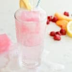A glass of Fizzy Drink with infused ice cubes