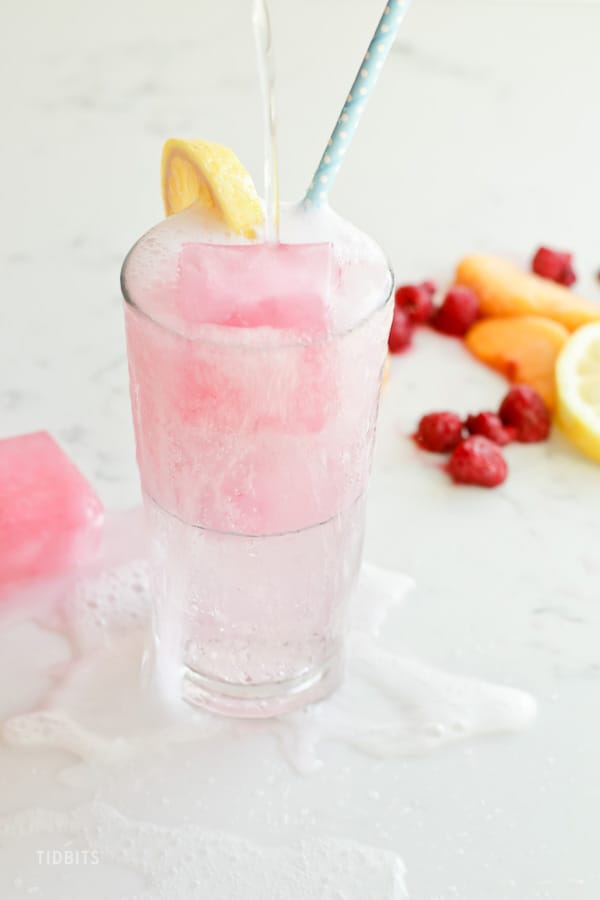 A glass of Fizzy Drink with infused ice cubes