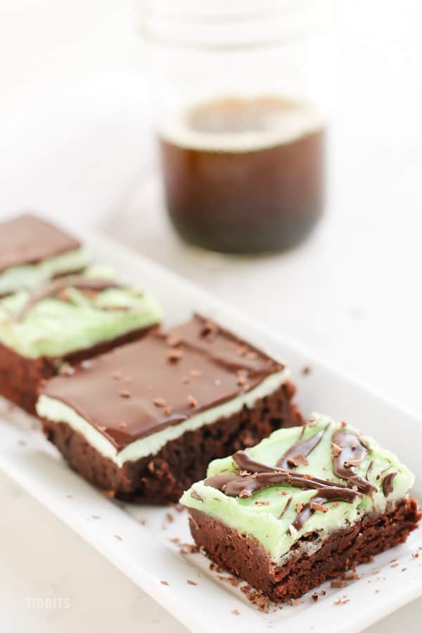 Peppermint chocolate brownies on a white serving plate