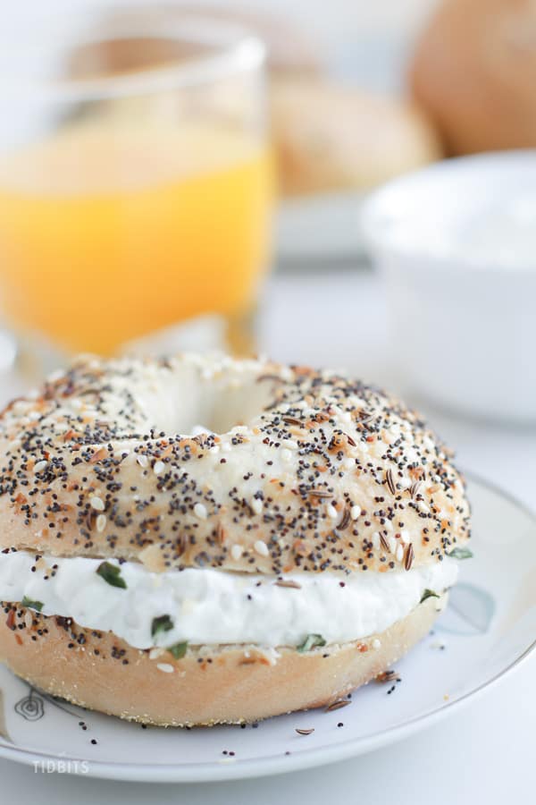 Skyr cream cheese as a bagel filling on a white plate