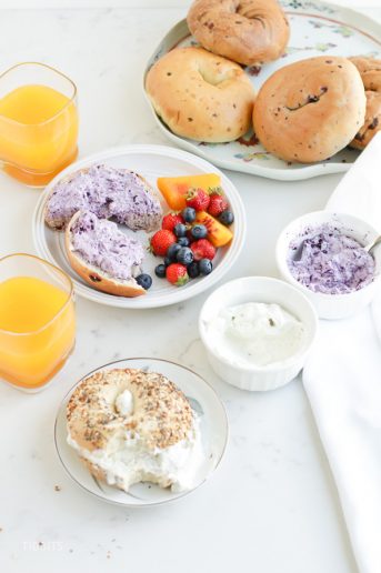 Pressure Cooker Skyr Cream Cheese in ramekins and spread on bagels on a breakfast table