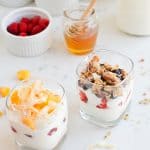 Two glasses of Instant Pot Yogurt Parfait with different toppings