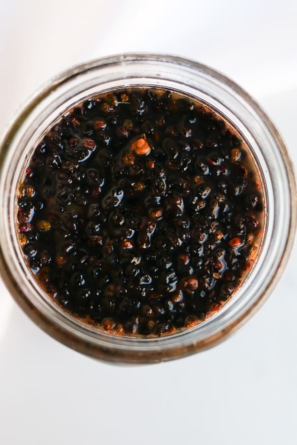 Top shot of Pressure Cooker Elderberry Juice in a mason jar