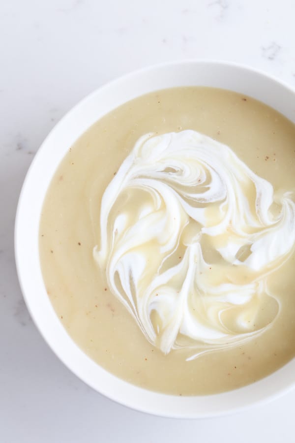 Pressure cooker baked potato soup topped with sour cream