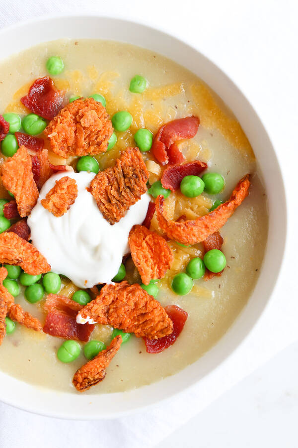 Top down shot of baked potato soup with toppings