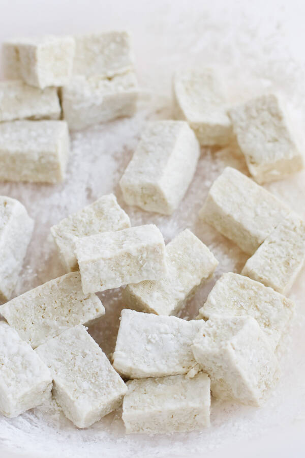 Close up of pressure cooker tofu pieces on a white background