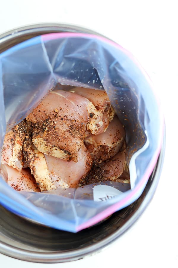 Top down shot of chicken breasts in a ziplock bag