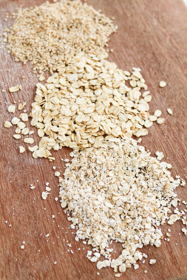 Three kinds of oats on a wooden worksurface