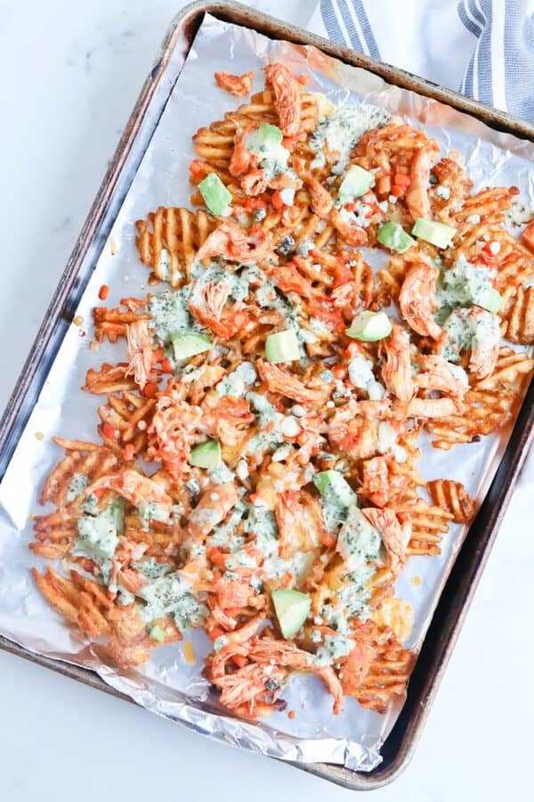 sheet pan of waffle fries and Instant Pot buffalo chicken