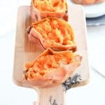 Instant Pot Sweet Potatoes on a cutting board