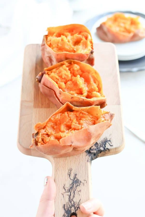 Instant Pot Sweet Potatoes on a cutting board