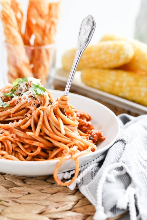 Bowl of spaghetti with fresh basil