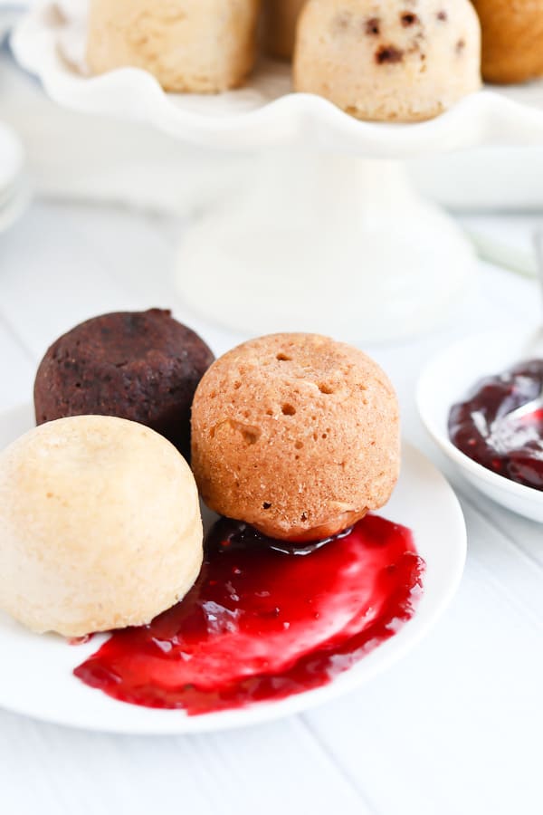 Pancake muffins on a plate with jam and honey