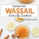 Hot Wassail in a cup with a cinnamons stick