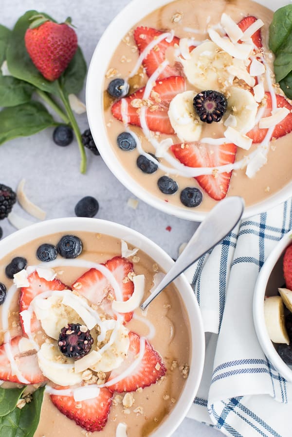 instant pot fruit soup in a bowl with fresh berries, coconut, and granola