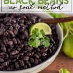 Instant Pot Black Beans in a white bowl with a lime wedge