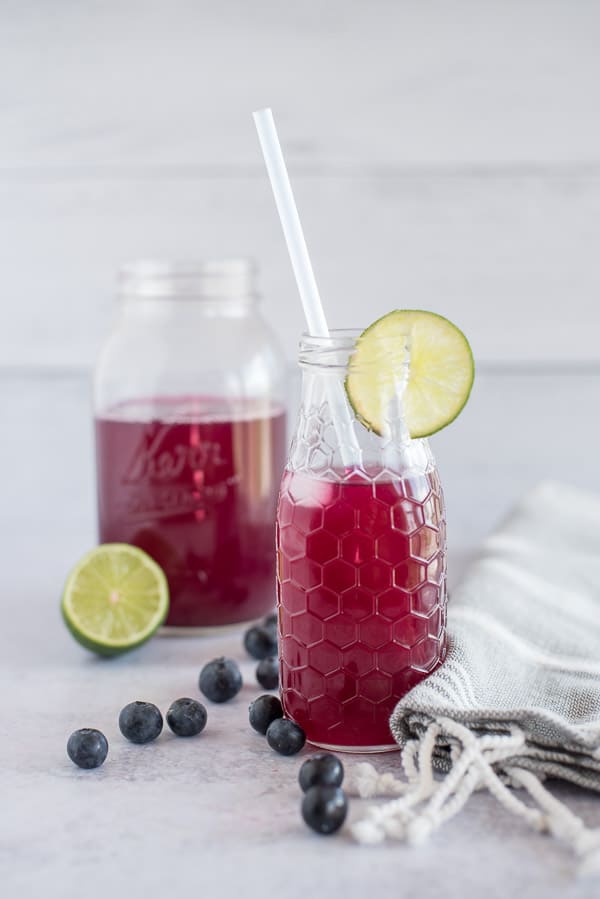 blueberry and lime flavored water with fresh limes slices