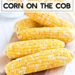 Corn on the cob on a wood cutting board