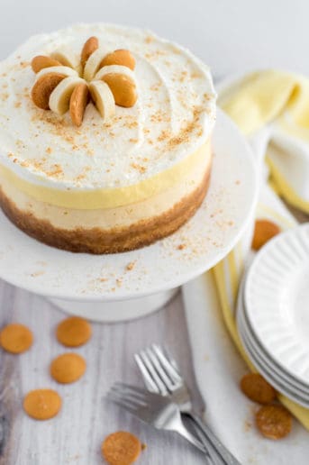 Banana cream pie cheesecake on a white plate with cookies