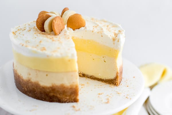 Banana cream pie cheesecake with a slice cut out