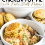 Bowl of chicken pot pie with a biscuit on top