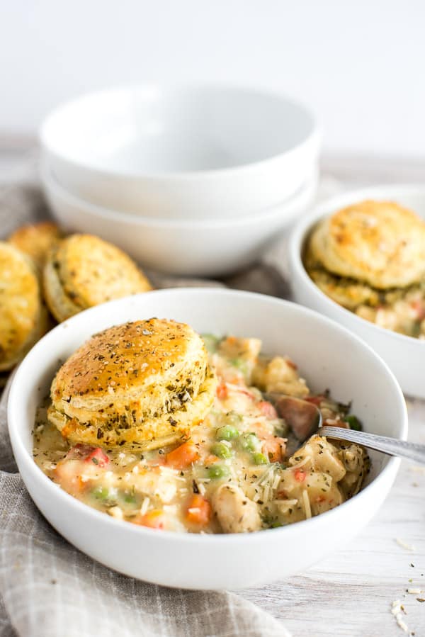 Bowl of chicken pot pie with a biscuit on top