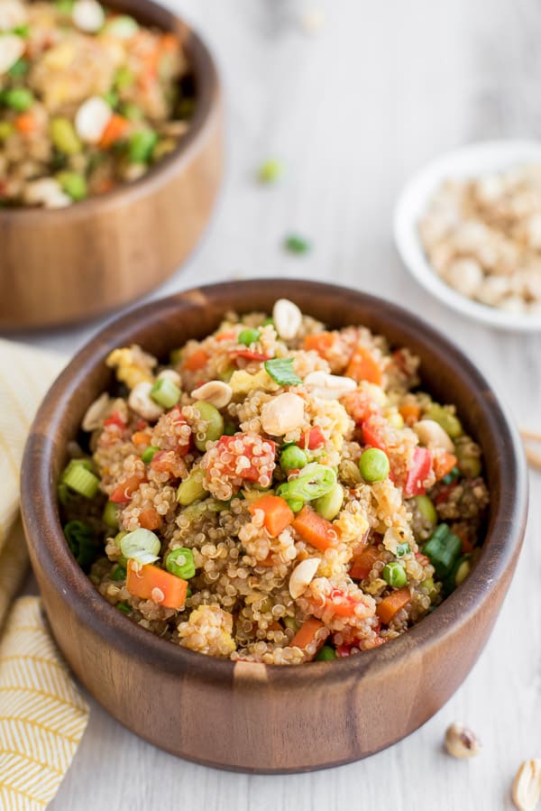 brown bowl with quinoa, peas, corn, and edamame