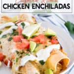 2 chicken enchiladas on a white plate with avocados and tomatoes