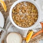 Instant Pot Carrot Cake Oatmeal with white yogurt sauce and orange slices