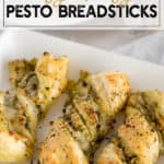 twisted pesto breadsticks on a white plate