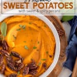 White bowl of mashed sweet potatoes with pecans on top