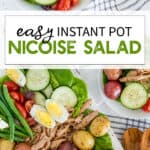 Nicoise salad with green beans, tomatoes, potatoes, cucumbers, tuna, and hardboiled eggs