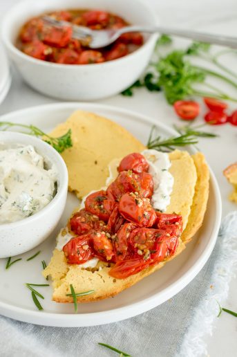 socca bread with cream cheese and tomatoes